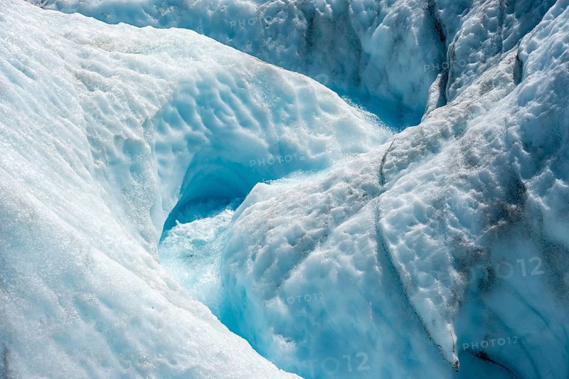 Waterfall in a crevasse on the ice of Root Glacier, Wrangell St. Elias National Park, Alaska, USA
