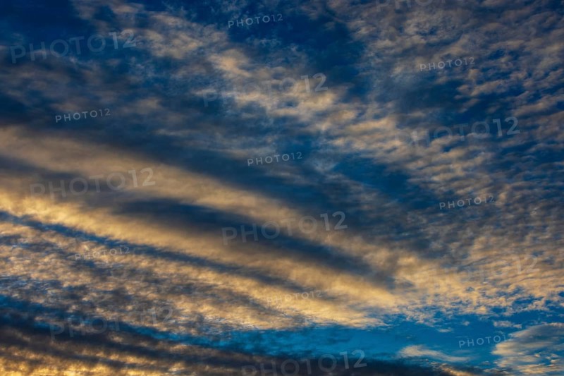 Dramatic cloudy sky, cirrus clouds at sunset, plume clouds, Austria