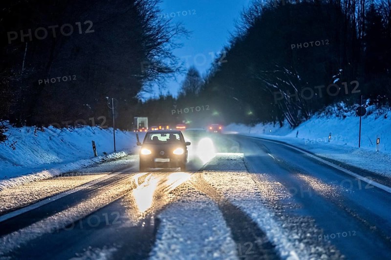 Country road with snow and slush Bergisches Land, near Marienheide, North Rhine-Westphalia, Germany