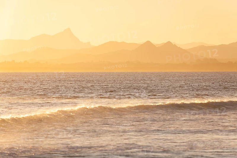 Evening light at Cape Byron with view to Mount Warning and sunlit hinterland, New South Wales, Australia
