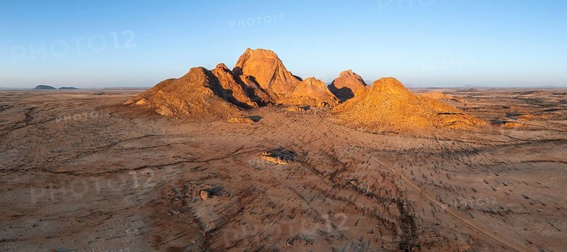 Aerial view, sunset, mountains in the desert, Spitzkoppe summit, Namib desert, Namibia