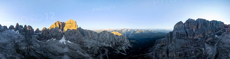 Aerial view, alpine panorama, Cima Tosa and rocky peaks at sunrise with alpine glow, picturesque mountain landscape, Brenta Dolomites, Trentino, Italy