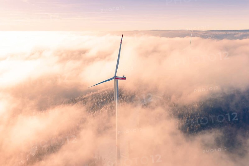 Wind turbine juts out of thick clouds, surrounded by foggy landscape, Bad Wildbad, Calw district, Black Forest, Germany