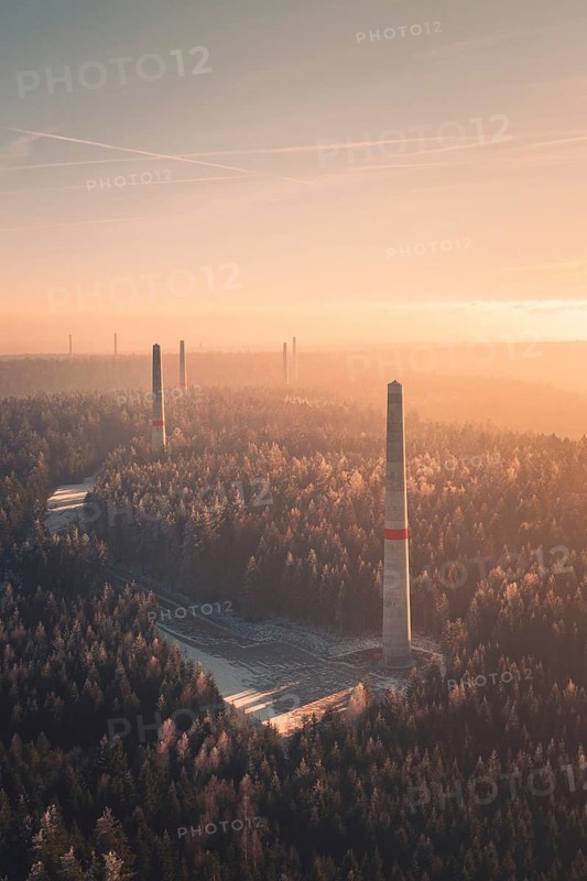 Wind turbine towers tower above a forest at sunset, soft pastel colors and fog create a quiet atmosphere, Windkraft Bau, Besenfeld, Seewald, Freudenstadt district, Germany