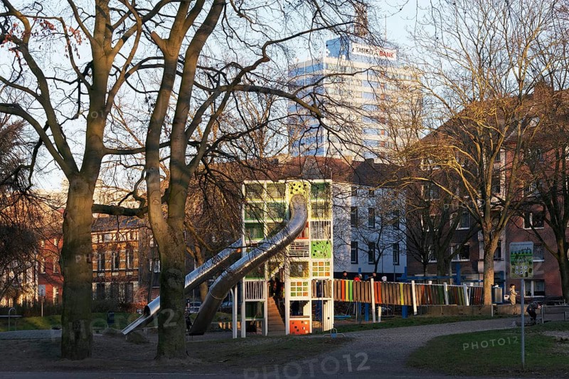 Children's playground with colorful climbing tower and slides, Immanuel-Kant-Park, Duisburg, North Rhine-Westphalia, Germany