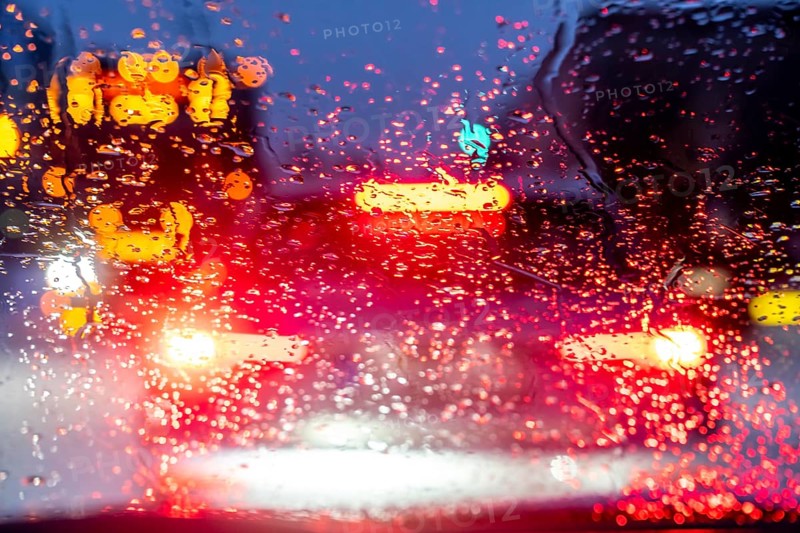 Driving in winter, in snow, rain, rear lights, brake lights
