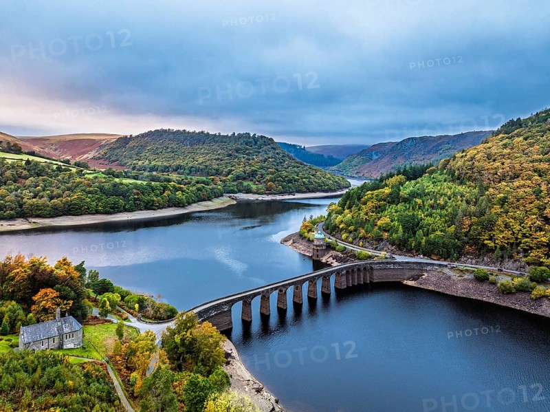 Autumn over Garreg Ddu Dam from a drone, Elan Valley, Caban-Coch Reservoir, Rhayader, Wales, UK