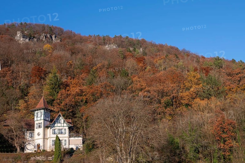 Historic villa in mixed autumn forest in Franconian Switzerland, Muggendorf, Upper Franconia, Bavaria, Germany