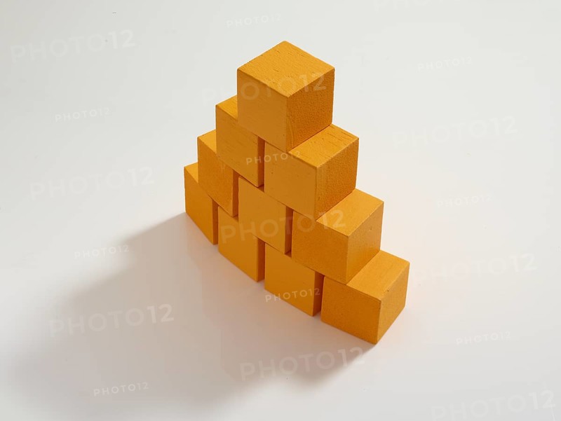 10 yellow wooden cubes against a white background
