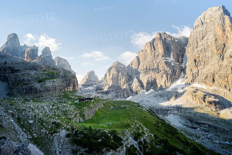 Picturesque mountain landscape in the morning, Rifugio Ai Brentei mountain hut and Cima Tosa rock peak, Brenta, Trentino, Italy