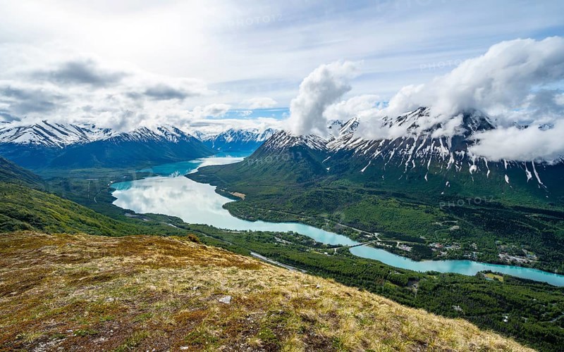 View of snowy mountains and turquoise lake Kenai Lake, Slaughter Ridge Trail, Cooper Landing, Kenai Peninsula, Alaska, USA