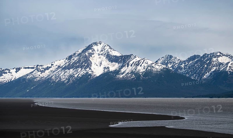 View of the Turnagain Arm estuary at low tide to the mountains of the Kenai Peninsula, Anchorage, Alaska, USA