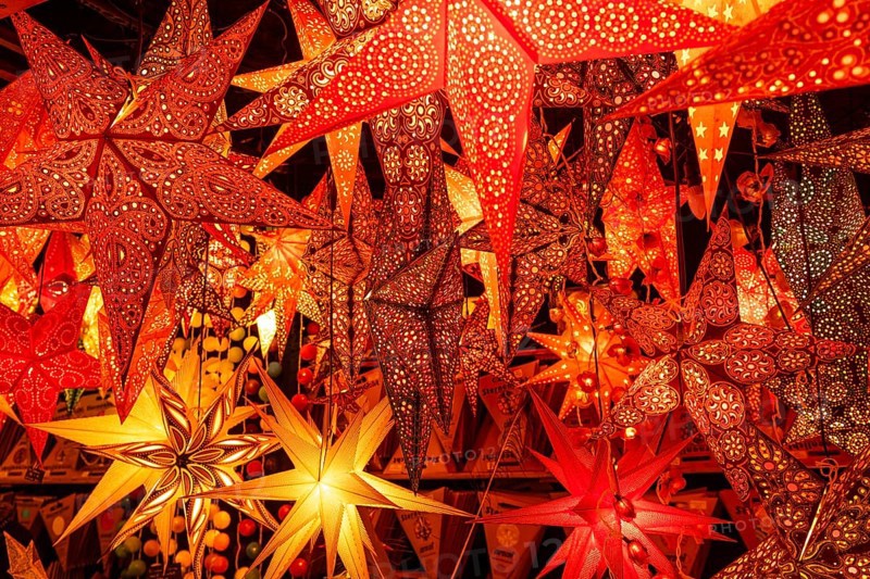 December 22, 2025, many glowing Christmas stars hanging at a market stall near St. Paul's Church, Frankfurt, Hesse, Germany
