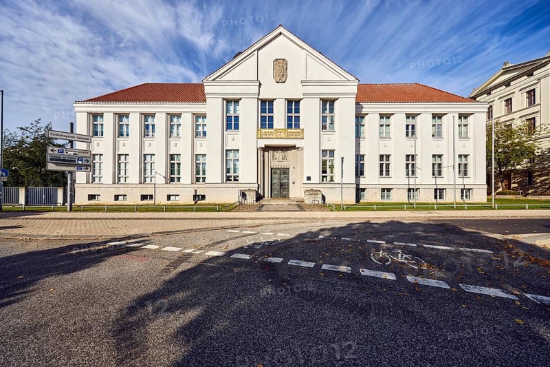 State archive, historic building, architect Paul Ehmig, central risalit, hipped roof, façade with windows and entrance, cycle path, blue sky, cirrus clouds, Graf-Schack-Allee, Schwerin, state capital, district-free city, Mecklenburg-Western Pomerania, Germany