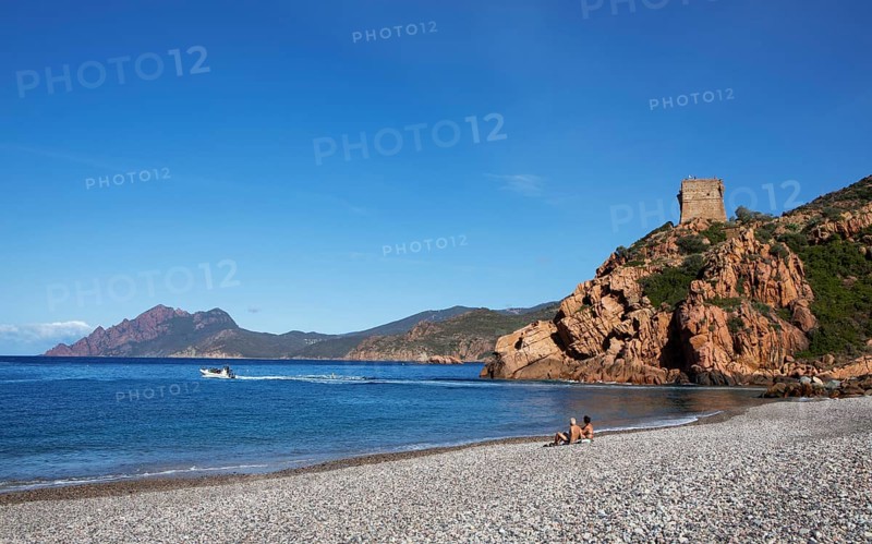 Genoese tower on the pebble beach of Porto, Ota, west coast of Corsica, Corse-du-Sud, Corsica, France