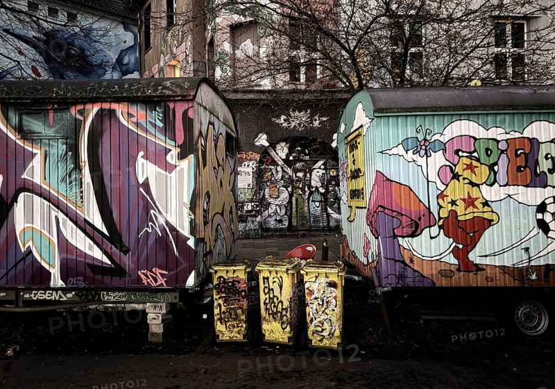 Kiefernstraße, residential street of the left-wing alternative scene with street art and construction trailer in the morning, Düsseldorf, North Rhine-Westphalia, Germany