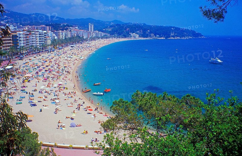 Skyscrapers, people, boats, trees, Lloret de Mar beach on the Costa de Maresme near Barcelona, Spain, June 1999, vintage, retro, old, historic