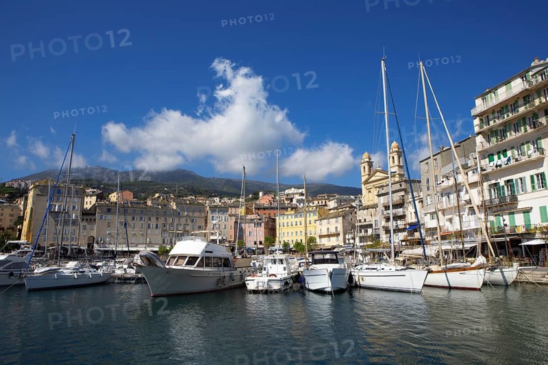 Old port with marina and church of Saint Jean-Baptiste à Bastia or church of St. John the Baptist, Port de Plaisance or Vieux Port, old town, Bastia, Haute-Corse department, Corsica, France