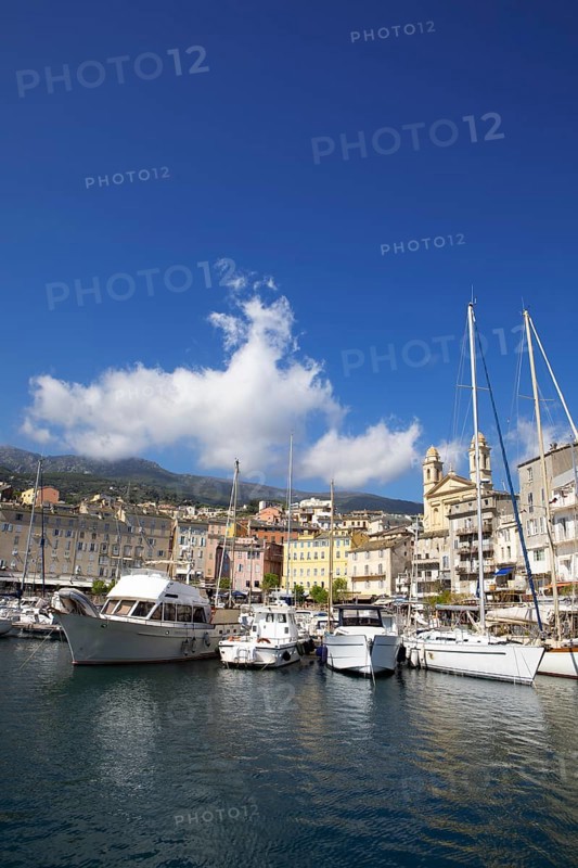 Old port with marina and church of Saint Jean-Baptiste à Bastia or church of St. John the Baptist, Port de Plaisance or Vieux Port, old town, Bastia, Haute-Corse department, Corsica, France