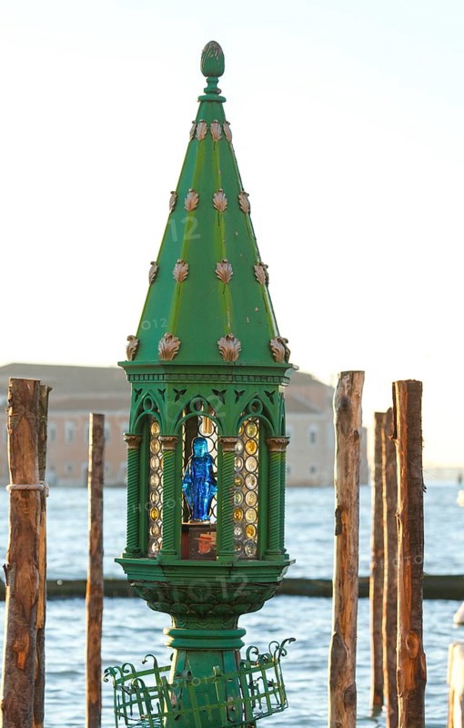 Lamp with portrait of Mary at a gondola station, Venice, Veneto, Italy