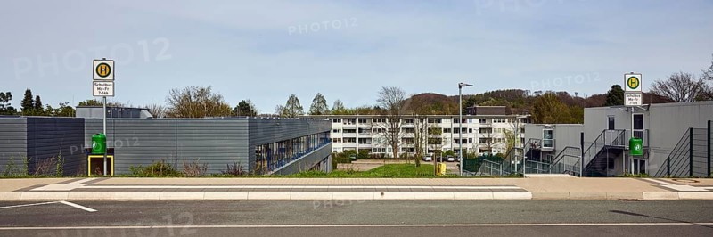 School bus stop, Hauptschule Mathilde - Anneke - school, houses, modern buildings, apartment buildings, residential buildings, lantern, trees, meadow, diffuse light, milky blue sky, cirrostratus clouds, Dresdener Straße, Sprockhövel, Ennepe-Ruhr-Kreis, North Rhine-Westphalia, Germany