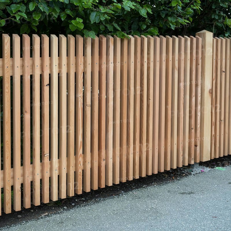 Wooden fence on the side of the road, vertical slats, town of Tegernsee, Upper Bavaria, Bavaria, Germany