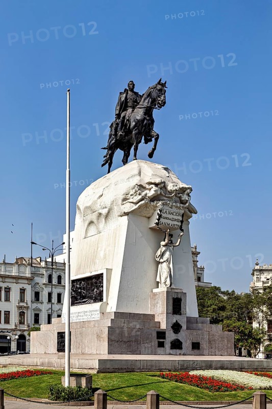 Impressive equestrian statue on an artfully designed monument against a sunny sky, Downtown Lima in Peru