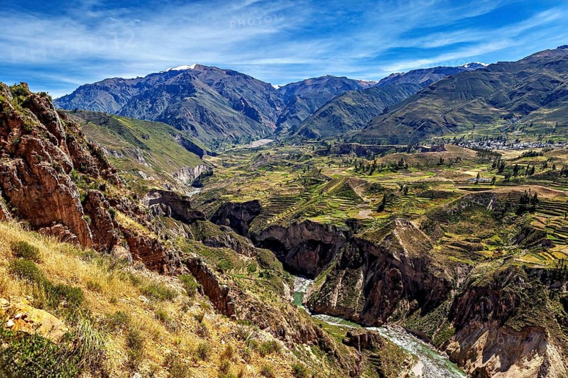 Deep gorge with river and terraced fields in the mountains, The landscape of the Colca Canyon in the Andes of Peru