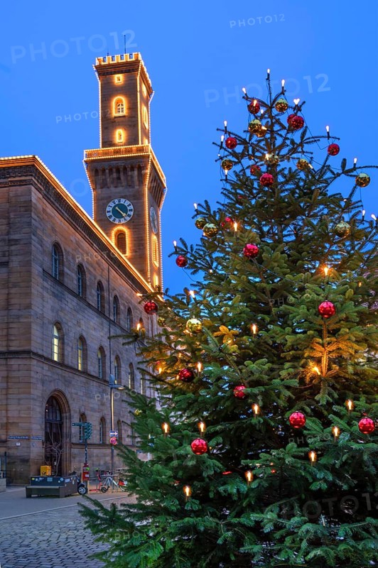 Fürth Town Hall in evening lighting, the tower is imitated the tower of the Palazzo Vecchio in Florence, on the right a decorated Christmas tree, blue evening sky, Fürth, Middle Franconia, Bavaria, Germany