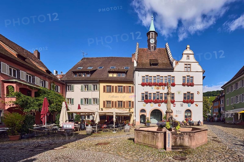Historic town hall, market fountain, general architecture, historic buildings, houses, town hall café, cobblestone square, blue sky, cumulus clouds, intersection of main street with Kirchstraße, Staufen im Breisgau, Black Forest, Breisgau-Hochschwarzwald district, Baden-Württemberg, Germany