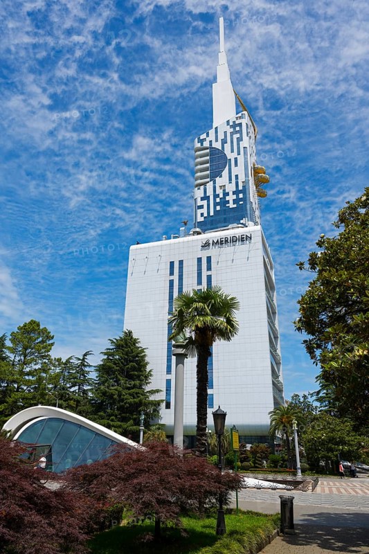 State-of-the-art building in the municipal park with palm trees against a blue sky, Batumi Tower with Ferris wheel, Batumi, Black Sea, Ajara region, Adjara, Autonomous Republic, Georgia