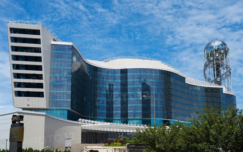 Modern building with wave-like design and glass façade under blue sky, business loft, right Alphabetic Tower, Georgian Alphabet Tower, Batumi, Black Sea, Adjara region, Adjara, Autonomous Republic, Georgia