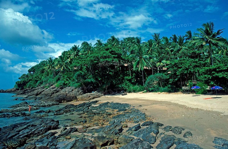 Umbrellas, palm beach at The Narima Resort on the island of Ko Lanta, Thailand, December 2002, vintage, retro, old, historic
