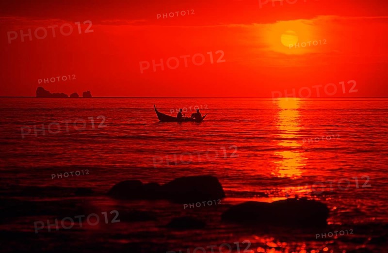 Fishing boat at sunset, silhouettes, orange filter, Ko Lanta island, Thailand, December 2002, vintage, retro, old, historic