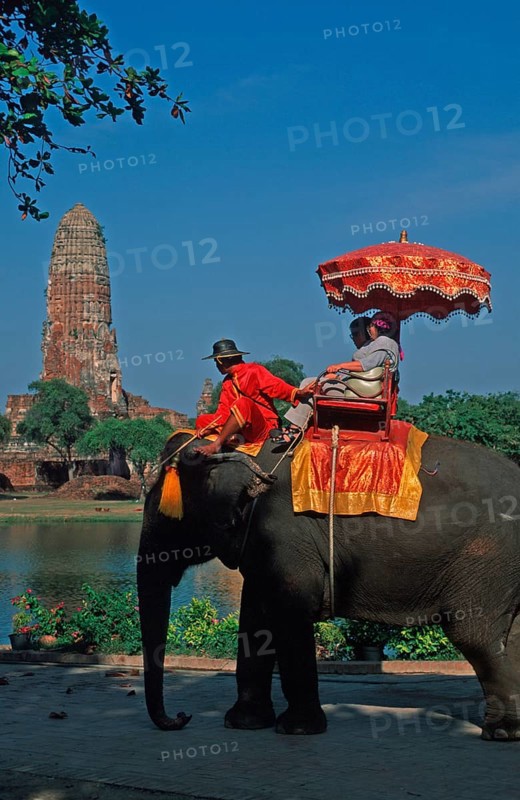 People, tourists, temple ruins, riding on an elephant through ancient sights, Ayutthaya, Thailand, December 2002, vintage, retro, old, historical
