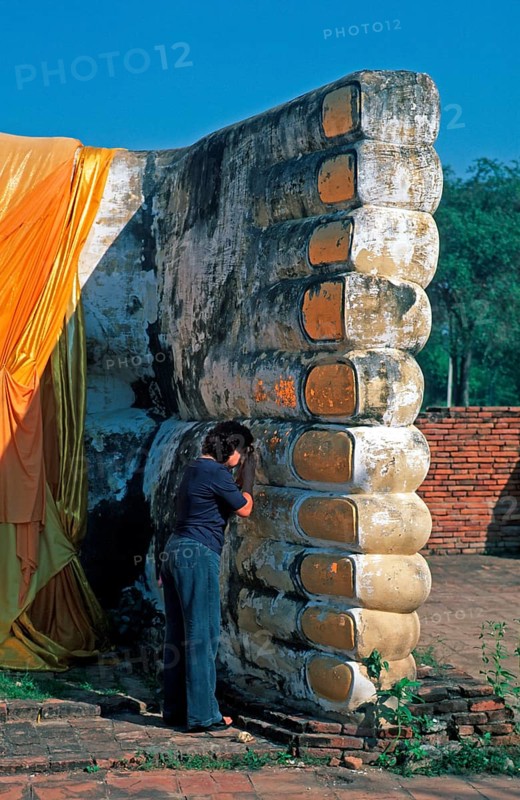 Woman praying, statue of reclining Buddha, feet, Ayutthaya, Thailand, December 2002, vintage, retro, old, historic