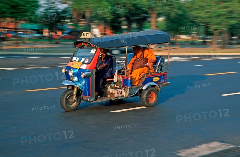 Monk in a three-wheeled tuk tuk taxi, blurred, Bangkok, Thailand, December 2002, vintage, retro, old, historic
