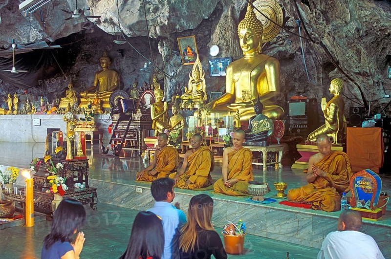 Buddha statue, monks and believers praying, Wat Tam Sua monastery near Krabi, Thailand, December 2002, vintage, retro, old, historic