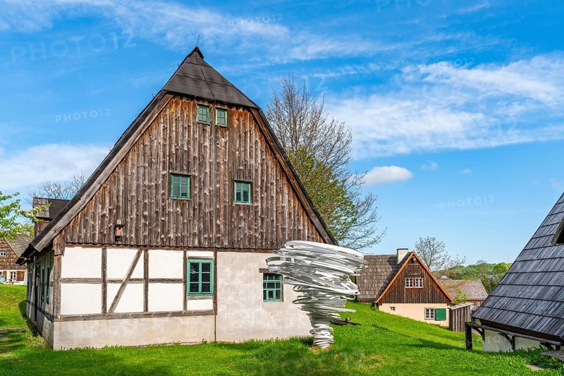 Sculpture, art installation Twister by artist and sculptor Alice Aycock, Purple Path art and sculpture trail of the European Cultural Region around the cultural capital Chemnitz, next to historic wooden houses in the Seiffen open-air museum, Ore Mountains, Saxony, Germany