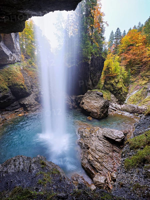 Waterfall mountain list in autumn-colored surroundings, Linthal, Klausenpass, Canton of Glarus, Switzerland