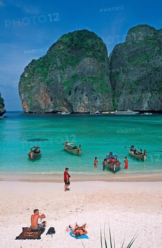 People, longtail boats on Maya Bay beach, known from the movie The Beach, one year in front of the tsunami, Ko Phi Phi Le, Thailand, December 2002, vintage, retro, old, historic