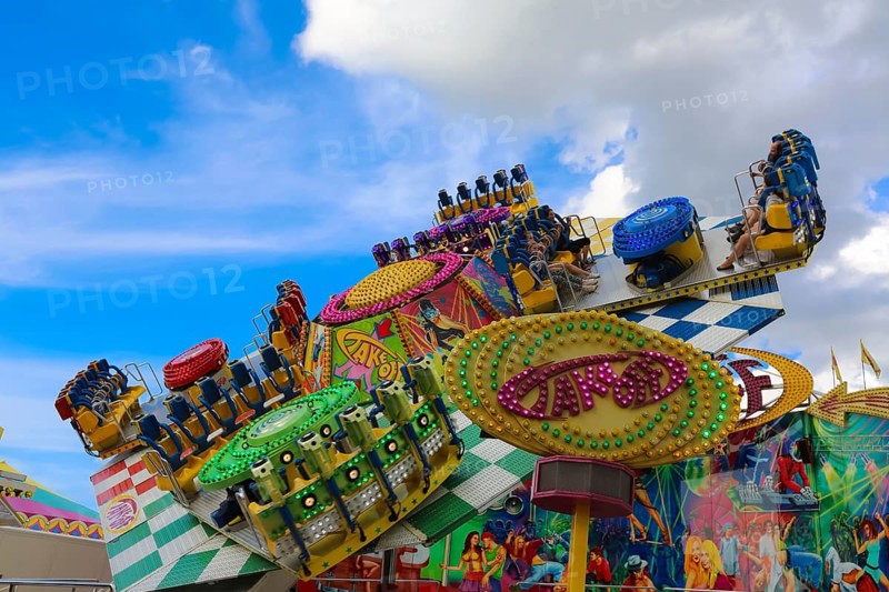 Fairground in Ulm Friedrichsau, folk festival, hustle and bustle, amusement park, amusement attraction, ride, blue sky, clouds, Ulm, Baden-Württemberg, Germany