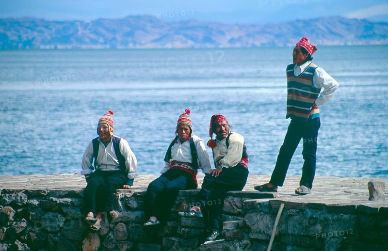 Men wearing traditional clothing on Isla Taquile in Lake Titicaca, Andean Highlands, Peru, South America, September 1997, vintage, retro, old, historic