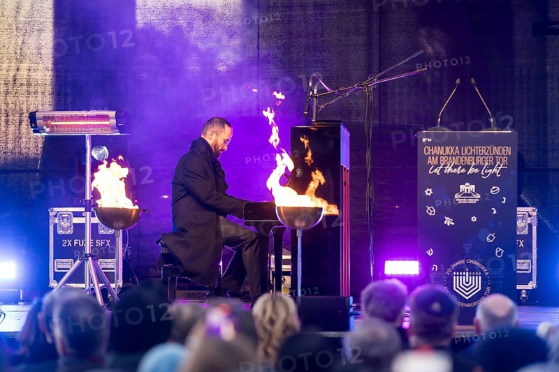 Igor Levit (pianist) plays the piano at the lighting of the 20th anniversary Hanukkah in front of the Brandenburg Tor, Berlin, 17.12.2025