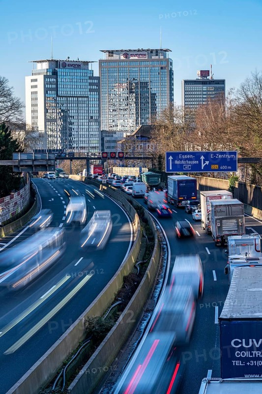 The A40 motorway, Ruhrschnellweg, in Essen, city skyline, Evonik office building, traffic jam in the westbound lane, Duisburg, slow traffic, North Rhine-Westphalia, Germany