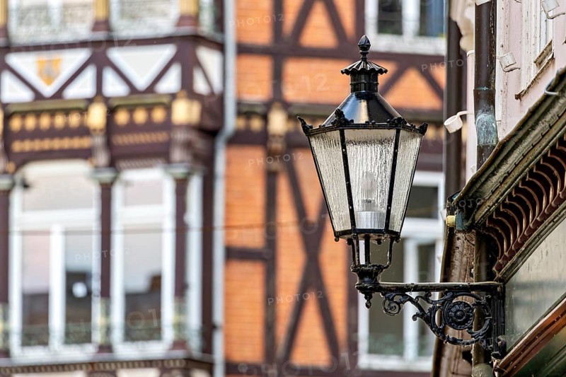 Nostalgic lantern in front of a half-timbered house with traditional architectural elements, The historic street lamps of Marburg an der Lahn in Hesse