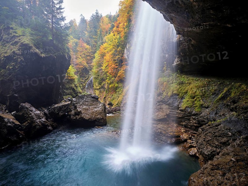 Waterfall mountain list in autumn-colored surroundings, Linthal, Klausenpass, Canton of Glarus, Switzerland