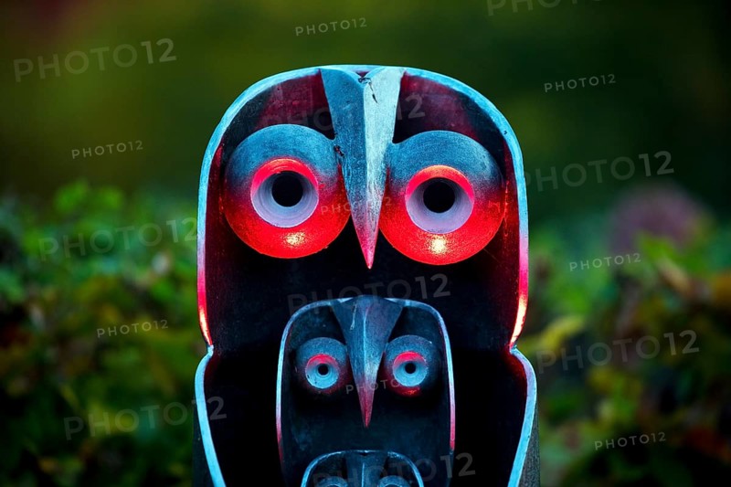 Illumination of an owl-like object during the HerbstlichtGarten event in Sauerlandpark in the evening in Hemer, Sauerland, North Rhine-Westphalia, Germany