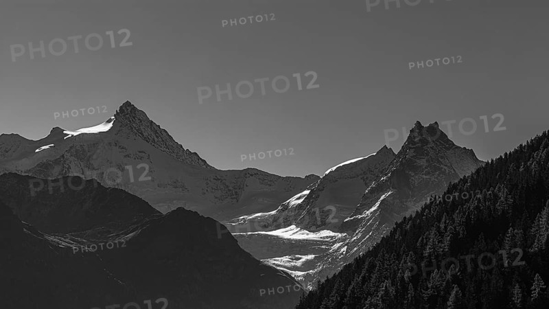 The snow-capped peaks of the Zinalrothorn and Besso mountains, black and white photo, Val d'Anniviers, Valais Alps, Switzerland