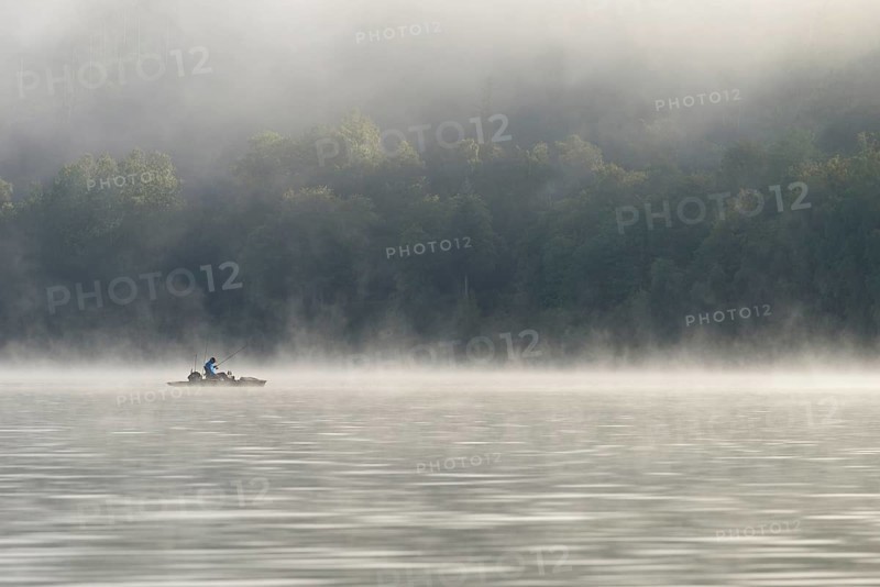 Hennesee, fog, rising clouds of fog, anglers in the boat, Hennetalsperre, Sauerland-Rothaargebirge nature park Park, North Rhine-Westphalia, Germany